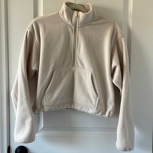 Aritzia TNA fleece croptop. (Priced at $10 for order $100+)
